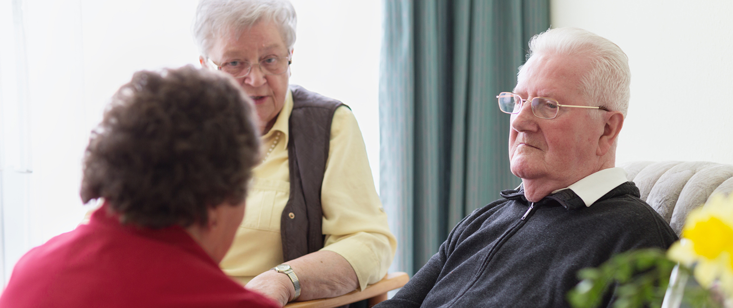 Senior man with Dementia, surrounded by family